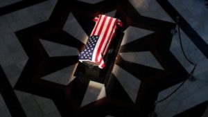 The casket of Sen. Richard Lugar is illuminated in the Indiana Statehouse rotunda in Indianapolis, Tuesday, May 14, 2019.(Michael Conroy / AP)