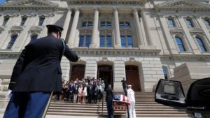 A military honor guard carries the casket of Sen. Richard Lugar into the Indiana Statehouse in Indianapolis, Tuesday, May 14, 2019. (Michael Conroy / AP)
